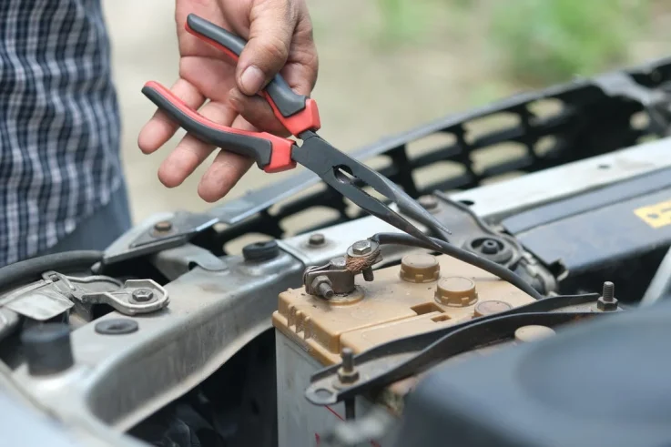 Free A Person Holding Red and Black Hand Tool Stock Photo